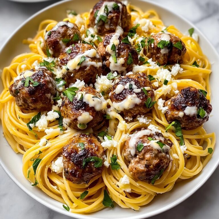 Easy Garlic Butter Meatballs Served Over Creamy Parmesan Linguine Recipe